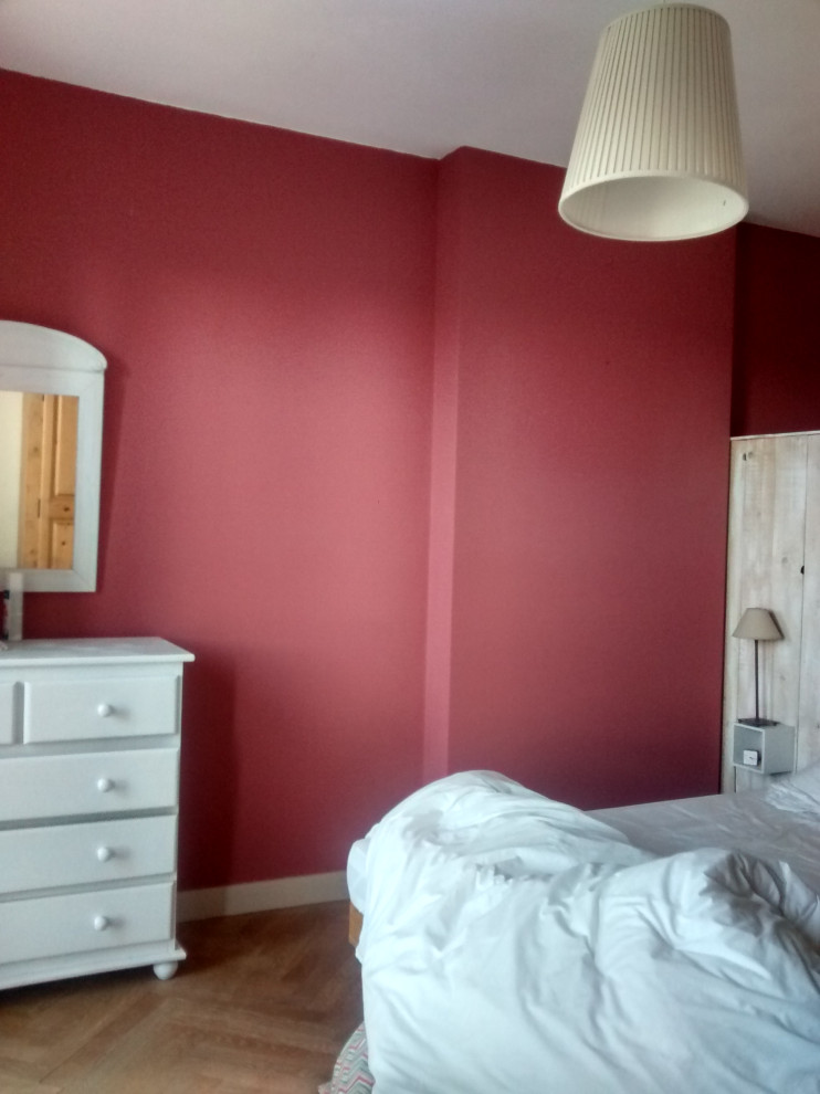 Photo of a medium sized classic master bedroom in Nantes with grey walls and light hardwood flooring.