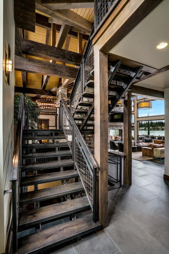 Design ideas for an expansive country u-shaped staircase in Seattle with metal railing.