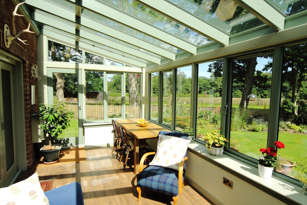 This is an example of a transitional sunroom in Other.