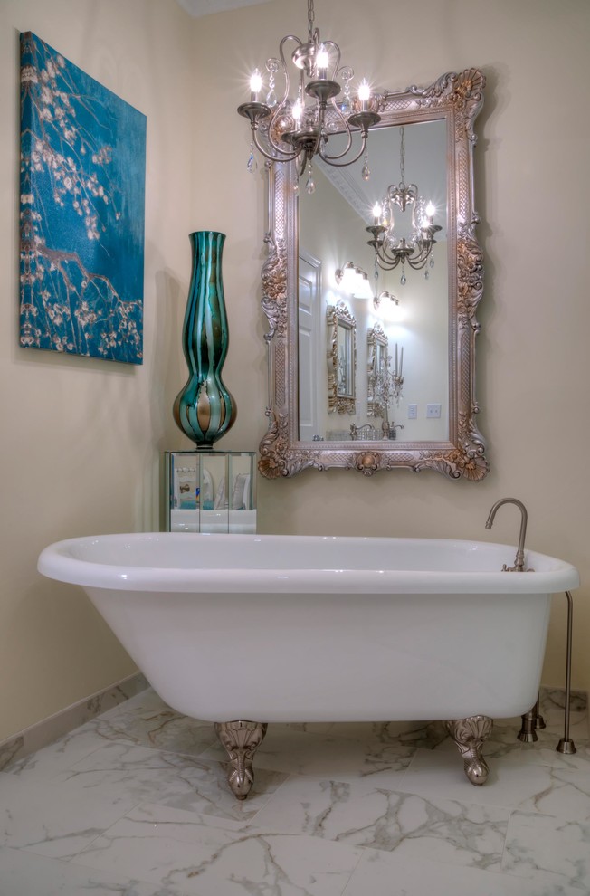 Inspiration for a large traditional master bathroom in St Louis with raised-panel cabinets, white cabinets, a freestanding tub, a curbless shower, a two-piece toilet, yellow walls, porcelain floors, an integrated sink, onyx benchtops, multi-coloured floor and a hinged shower door.