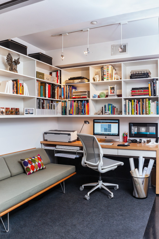 Contemporary study room in DC Metro with carpet, a built-in desk and white walls.