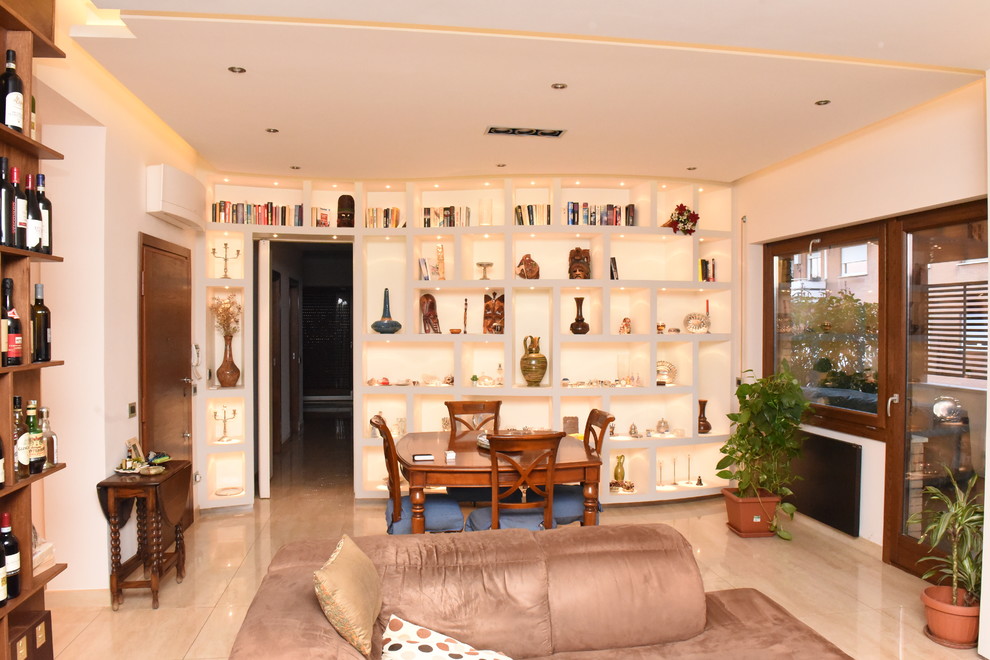 Photo of a large contemporary open concept living room in Rome with a library, white walls, porcelain floors, a wall-mounted tv and beige floor.