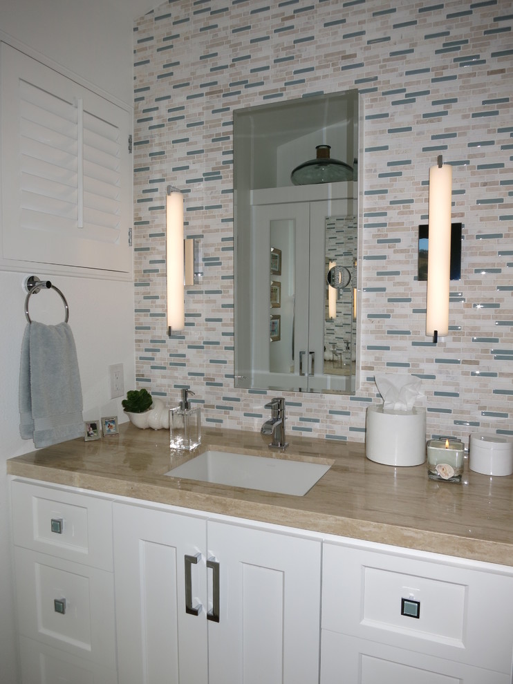 Photo of a small contemporary master bathroom in Los Angeles with an undermount sink, shaker cabinets, white cabinets, marble benchtops, white tile, matchstick tile, white walls and travertine floors.