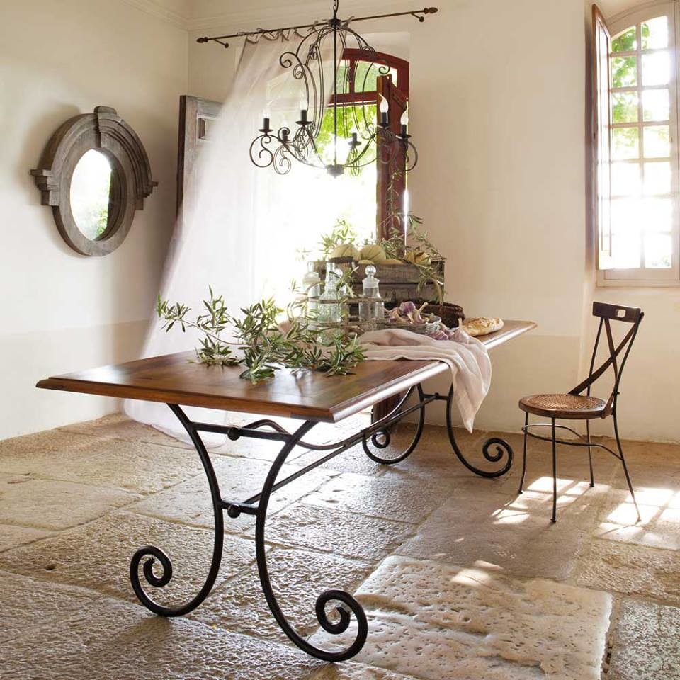 Design ideas for a mid-sized country separate dining room in Florence with beige walls, limestone floors and beige floor.