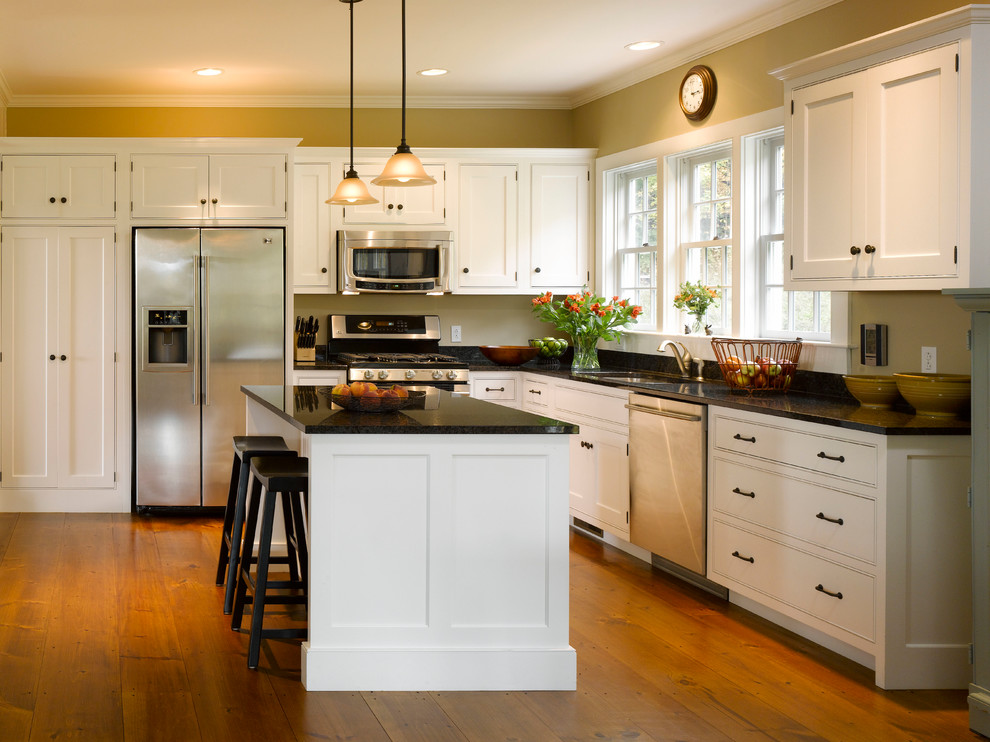 Design ideas for a country l-shaped kitchen in Richmond with an undermount sink, beaded inset cabinets, white cabinets and stainless steel appliances.