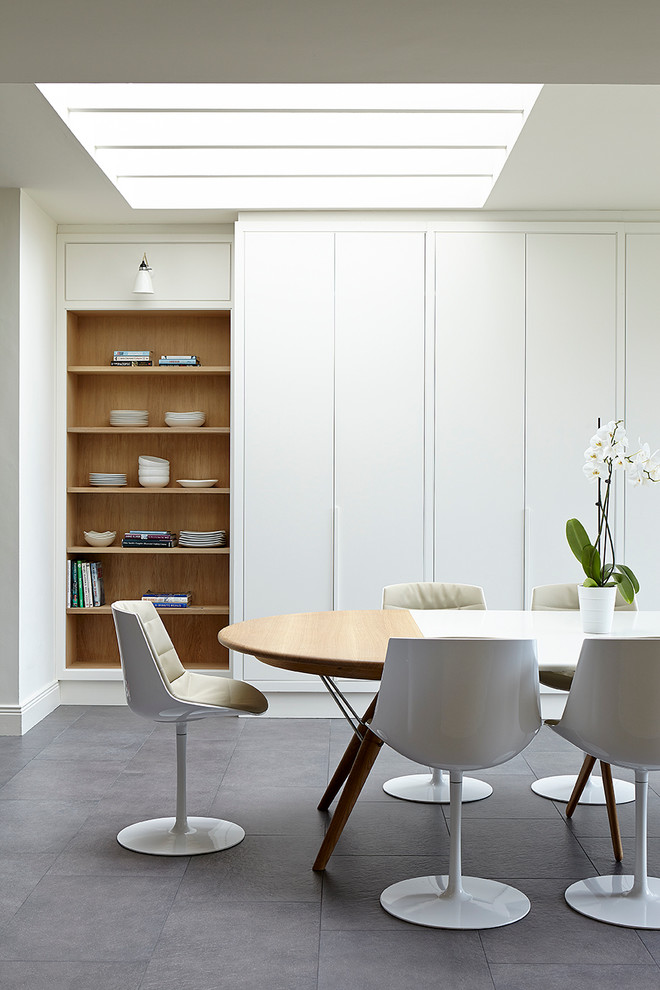 Inspiration for a transitional dining room in Dublin with white walls.
