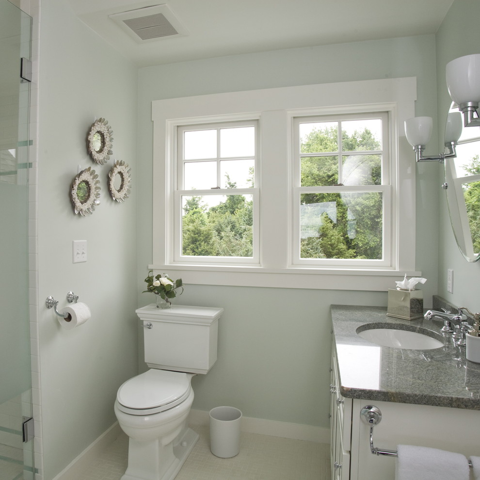 Design ideas for a beach style bathroom in Providence with white cabinets.