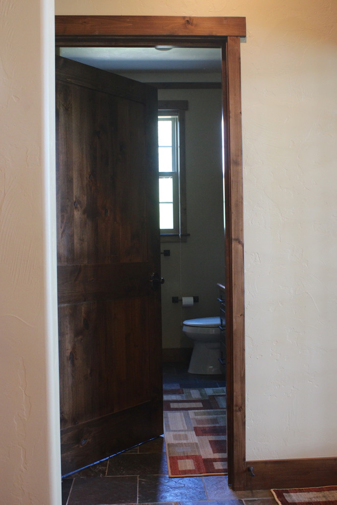 Large transitional slate floor and gray floor hallway photo with beige walls