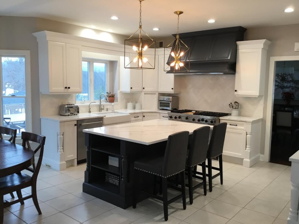 A Transitional Kitchen with a gorgeous Herringbone marble backsplash