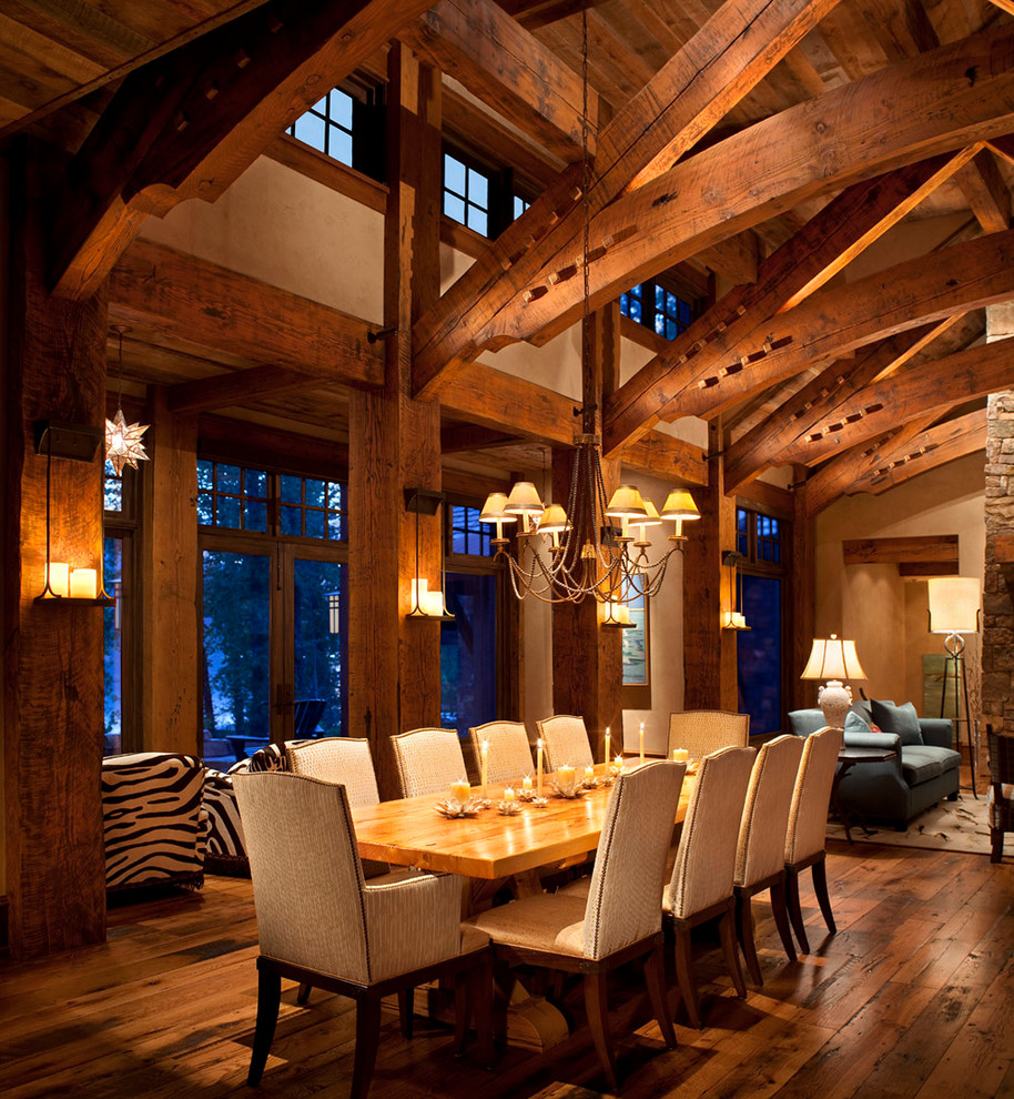 Inspiration for a country dining room in Other with white walls and dark hardwood floors.