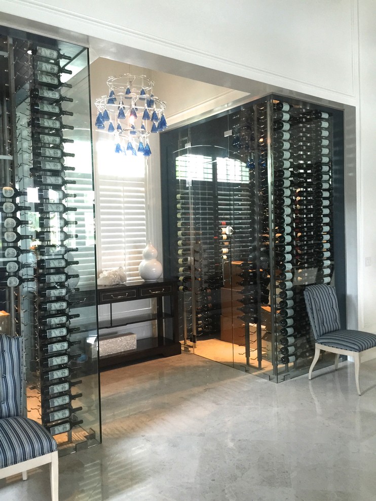 Design ideas for a large transitional wine cellar in Miami with marble floors and storage racks.