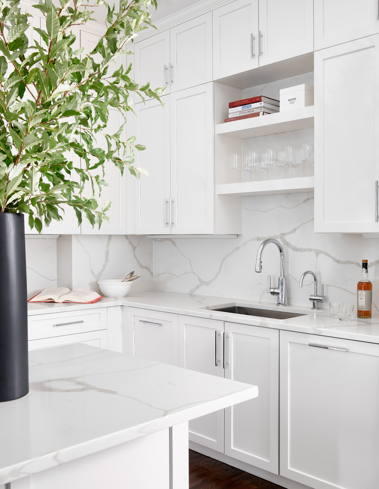 Eat-in kitchen - mid-sized transitional u-shaped eat-in kitchen idea in Boston with quartzite countertops, white backsplash, an island and white countertops