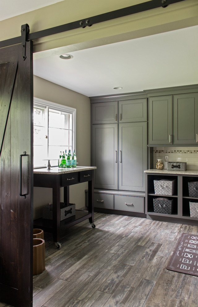 Inspiration for a mid-sized transitional u-shaped utility room in Other with an undermount sink, grey cabinets, granite benchtops, beige walls and a side-by-side washer and dryer.
