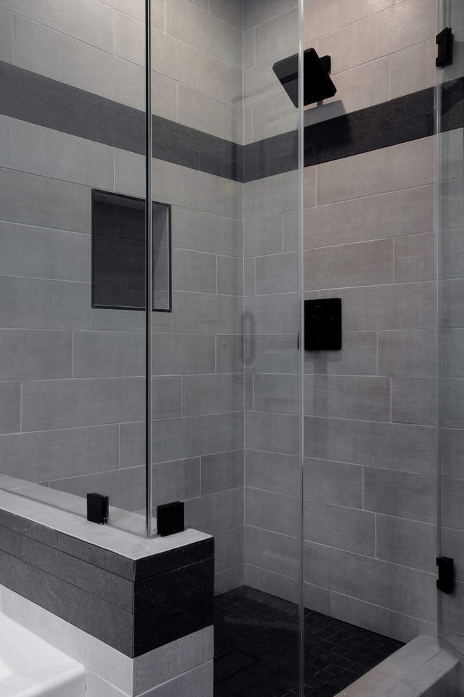Mid-sized minimalist kids' gray tile and porcelain tile slate floor and black floor bathroom photo in Los Angeles with flat-panel cabinets, white cabinets, a one-piece toilet, white walls, an integrated sink, solid surface countertops, a hinged shower door and white countertops