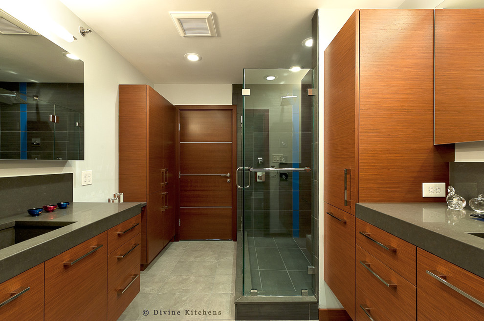 Photo of a large modern master bathroom in Boston with an undermount sink, flat-panel cabinets, dark wood cabinets, engineered quartz benchtops, a corner tub, a corner shower, a two-piece toilet, brown tile, porcelain tile, white walls and porcelain floors.