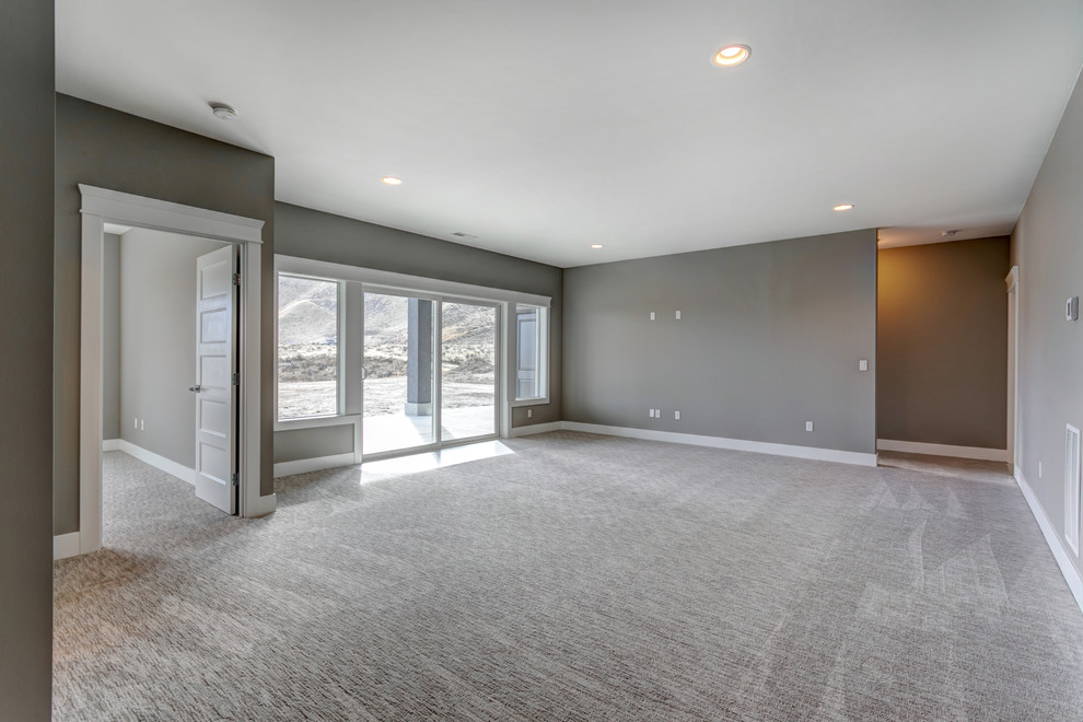 Basement - mid-sized transitional walk-out carpeted and gray floor basement idea in Seattle with gray walls and no fireplace