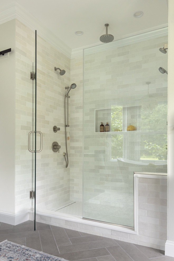 This is an example of a large transitional master bathroom in Philadelphia with shaker cabinets, light wood cabinets, a freestanding tub, an open shower, a one-piece toilet, grey walls, porcelain floors, an integrated sink, engineered quartz benchtops, grey floor, a hinged shower door, white benchtops, an enclosed toilet, a double vanity and a freestanding vanity.
