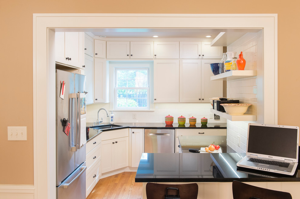 Design ideas for a traditional kitchen in Cleveland with shaker cabinets and white cabinets.