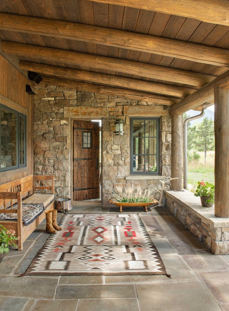 Inspiration for a country front door in Other with a single front door and a medium wood front door.