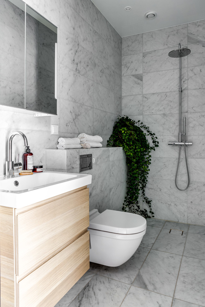 Inspiration for a modern bathroom in Stockholm with an open shower.
