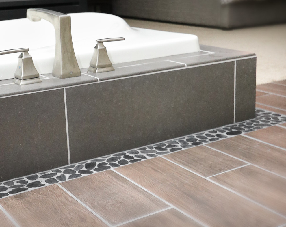 Mid-sized transitional master gray tile and porcelain tile porcelain tile and gray floor drop-in bathtub photo with gray walls