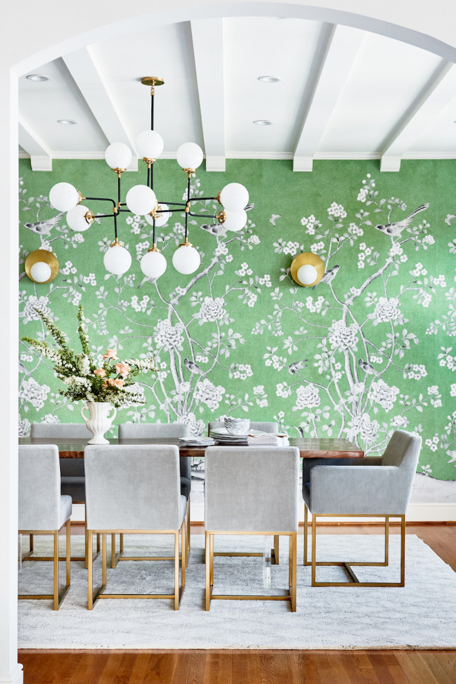 Photo of a large transitional separate dining room in San Francisco with green walls, medium hardwood floors, green floor, exposed beam and wallpaper.