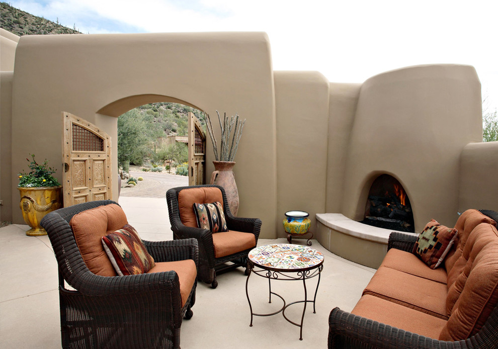 This is an example of a courtyard patio in Phoenix with a fire feature.