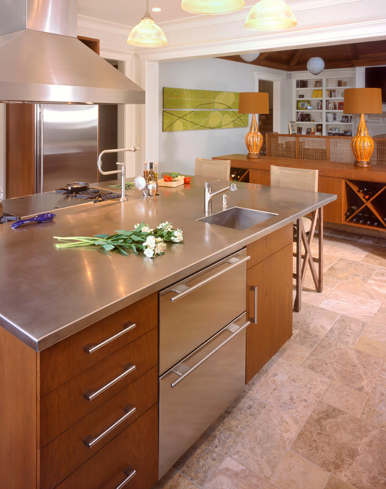 Inspiration for a contemporary u-shaped kitchen in Nashville with stainless steel appliances, beige floor, travertine floors, an undermount sink, flat-panel cabinets, medium wood cabinets, stainless steel benchtops, multi-coloured splashback and with island.