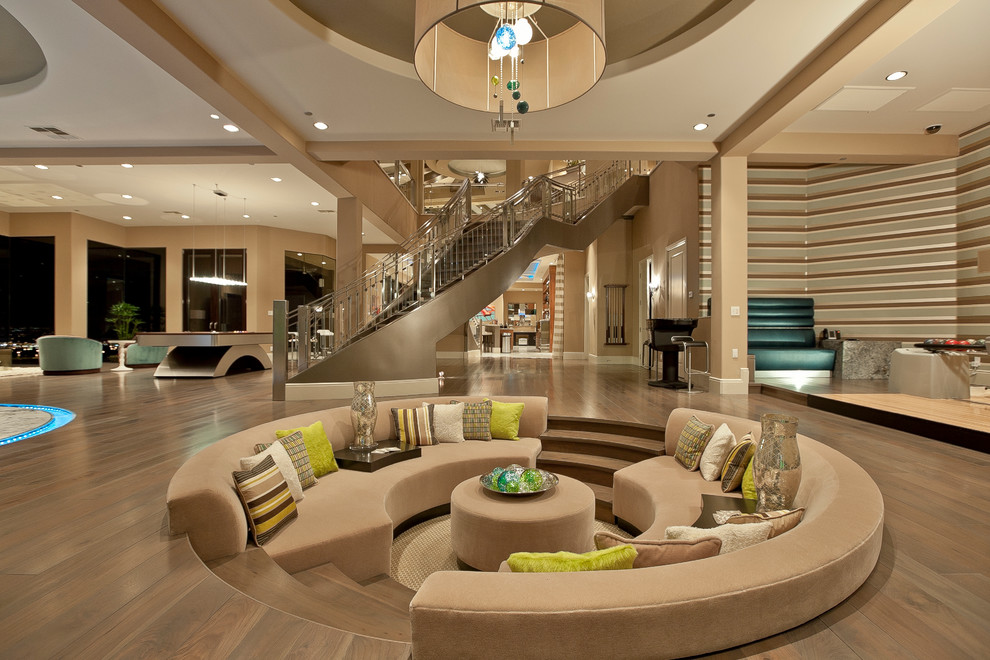 Inspiration for an expansive contemporary open concept living room in Las Vegas with beige walls.