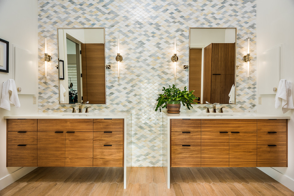 Large contemporary master bathroom in Other with flat-panel cabinets, medium wood cabinets, multi-coloured tile, mosaic tile, porcelain floors, engineered quartz benchtops, brown floor, white benchtops, a double vanity, a floating vanity, white walls and an undermount sink.
