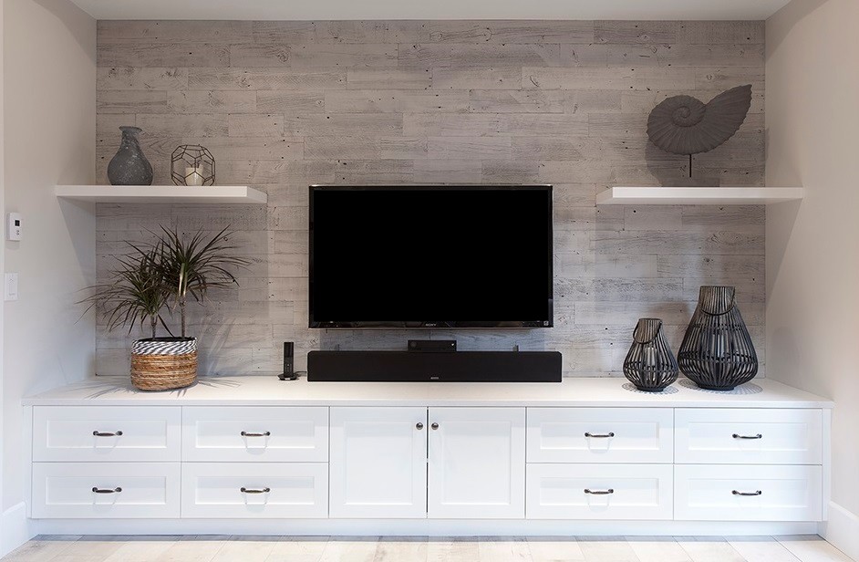 Mid-sized beach style open concept family room in Vancouver with porcelain floors and a built-in media wall.