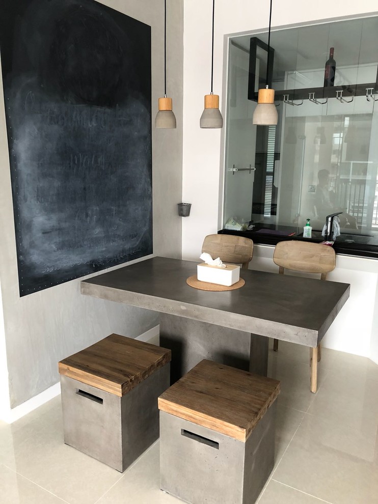 This is an example of an asian dining room in Singapore with grey walls and beige floor.