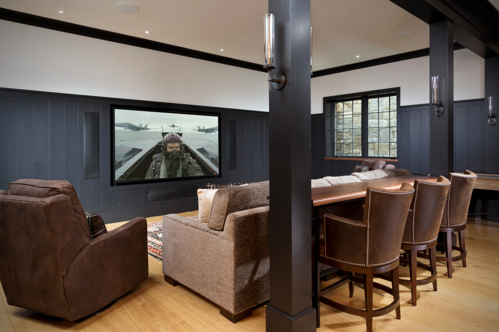 Home theater - transitional light wood floor home theater idea in Boston with a media wall