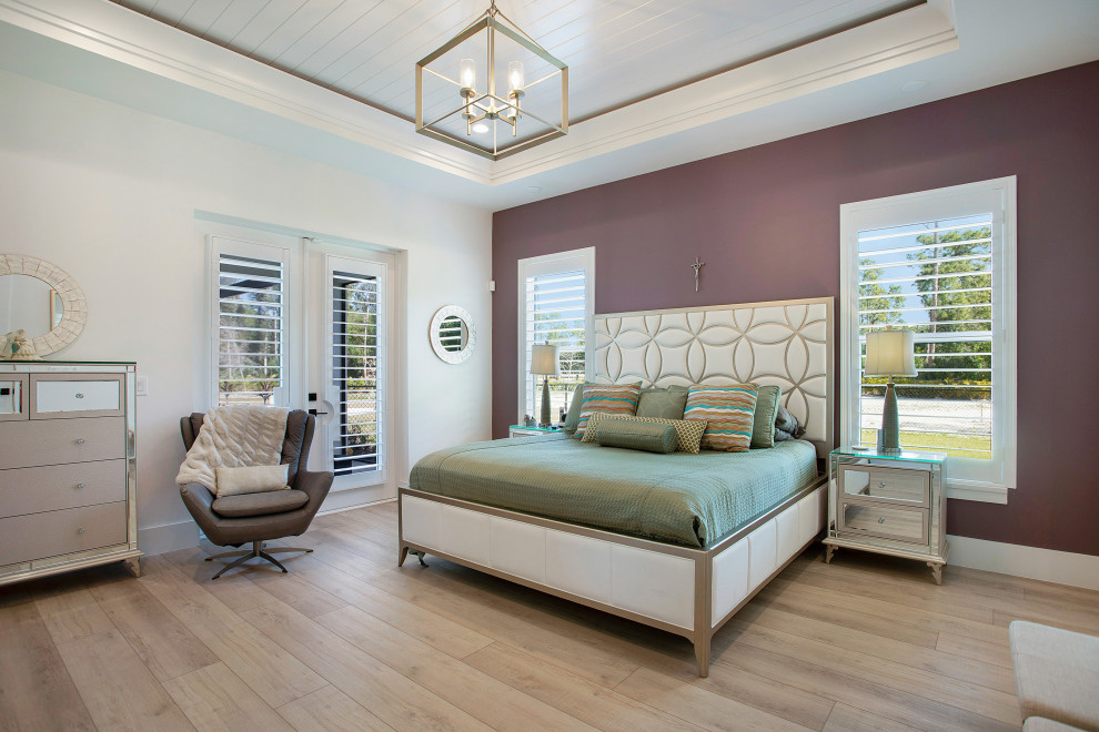 Inspiration for a classic master bedroom in Miami with white walls, medium hardwood flooring, no fireplace, brown floors and a wood ceiling.