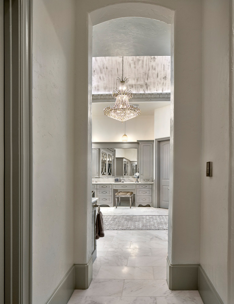 Photo of an expansive traditional master bathroom in Dallas with marble benchtops, a double vanity and a built-in vanity.