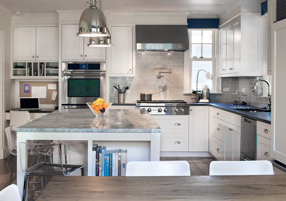 Design ideas for a large transitional l-shaped eat-in kitchen in Boston with an undermount sink, beaded inset cabinets, white cabinets, quartzite benchtops, blue splashback, porcelain splashback, stainless steel appliances, medium hardwood floors and with island.