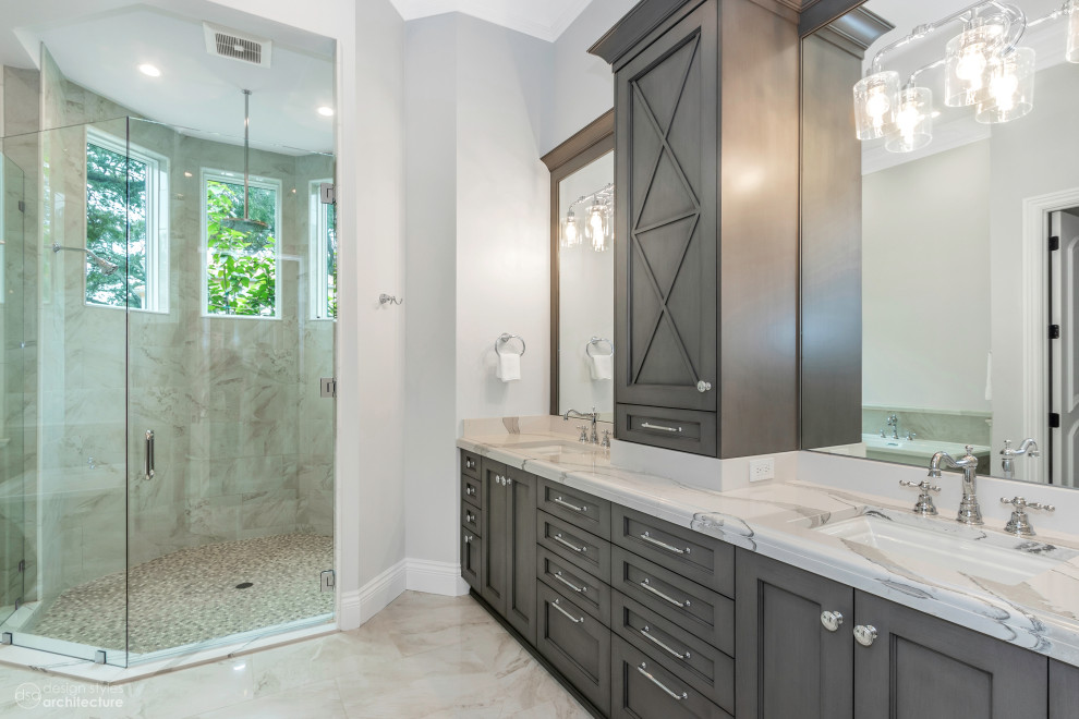Large ensuite bathroom in Tampa with shaker cabinets, grey cabinets, an alcove shower, grey walls, marble flooring, a built-in sink, marble worktops, beige floors, a hinged door, white worktops, double sinks and a built in vanity unit.