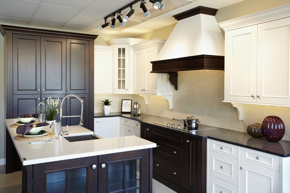This is an example of a large traditional l-shaped eat-in kitchen in Vancouver with a single-bowl sink, shaker cabinets, quartz benchtops, beige splashback and with island.