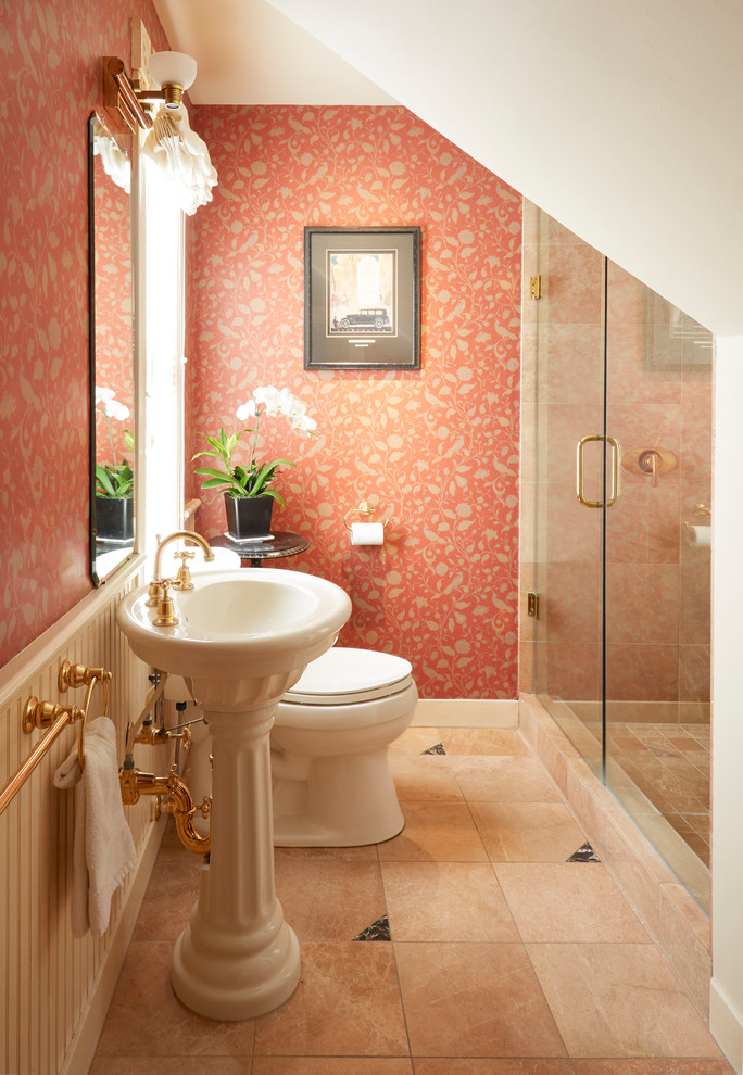 Photo of a mid-sized traditional bathroom in San Francisco with a two-piece toilet, orange tile, marble, orange walls, marble floors, a pedestal sink and orange floor.