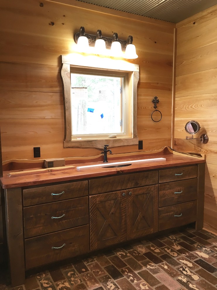 Mountain style master home design photo in Jackson with recessed-panel cabinets, medium tone wood cabinets and wood countertops