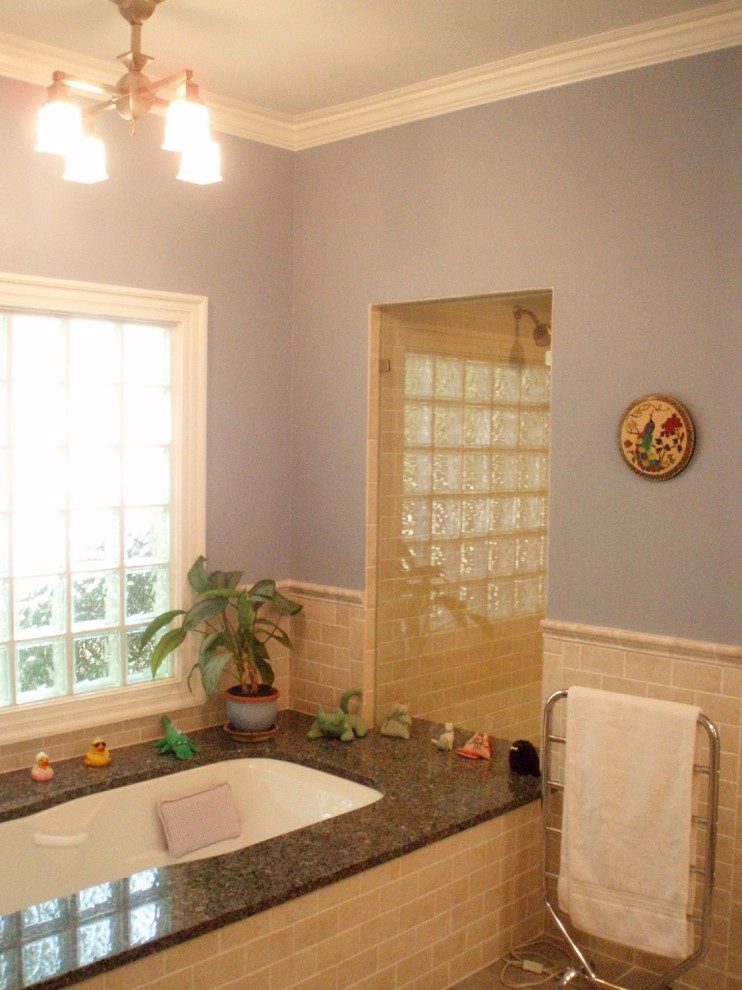 Design ideas for a mid-sized beach style master bathroom in Charlotte with white cabinets, an undermount tub, an alcove shower, beige tile, ceramic tile, blue walls, ceramic floors, an undermount sink and granite benchtops.