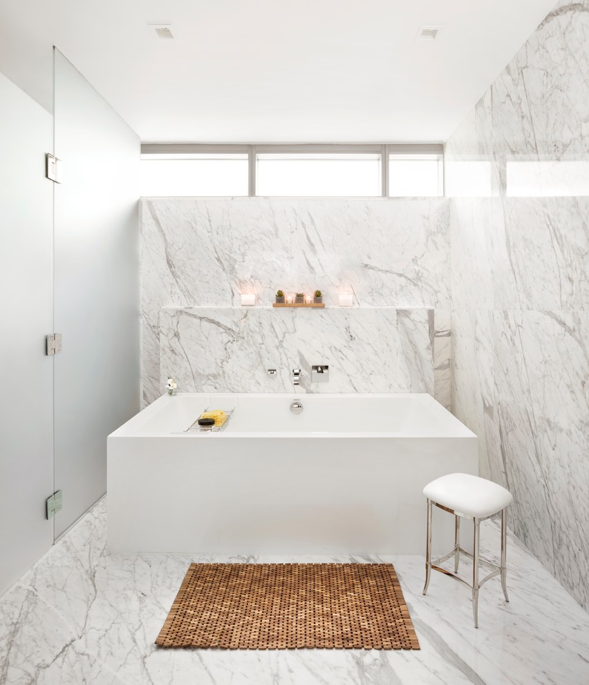 Large contemporary master wet room bathroom in Miami with a freestanding tub, gray tile, white tile, marble, grey walls, marble floors, grey floor and a hinged shower door.