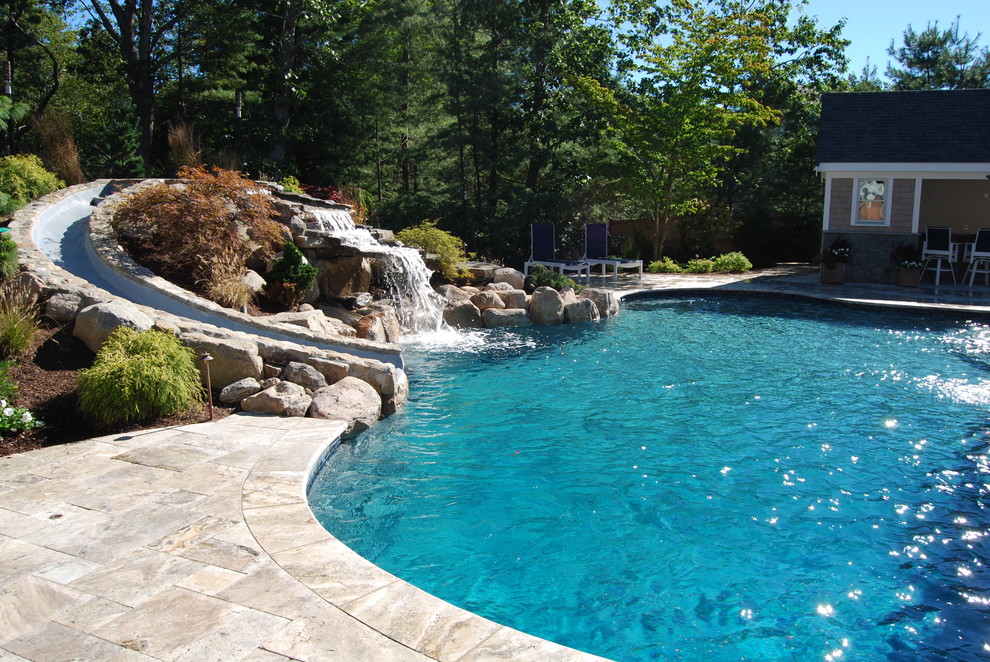 Inspiration for a mid-sized rustic backyard stone and kidney-shaped natural water slide remodel in Boston
