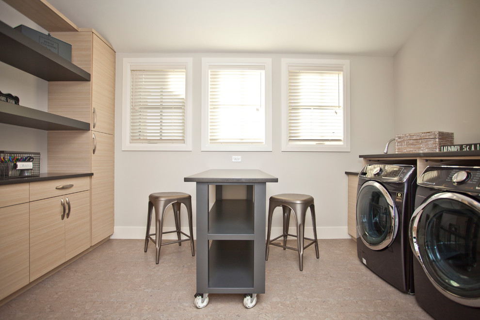 Traditional utility room in Calgary with flat-panel cabinets, light wood cabinets, granite benchtops, grey walls, cork floors and a side-by-side washer and dryer.