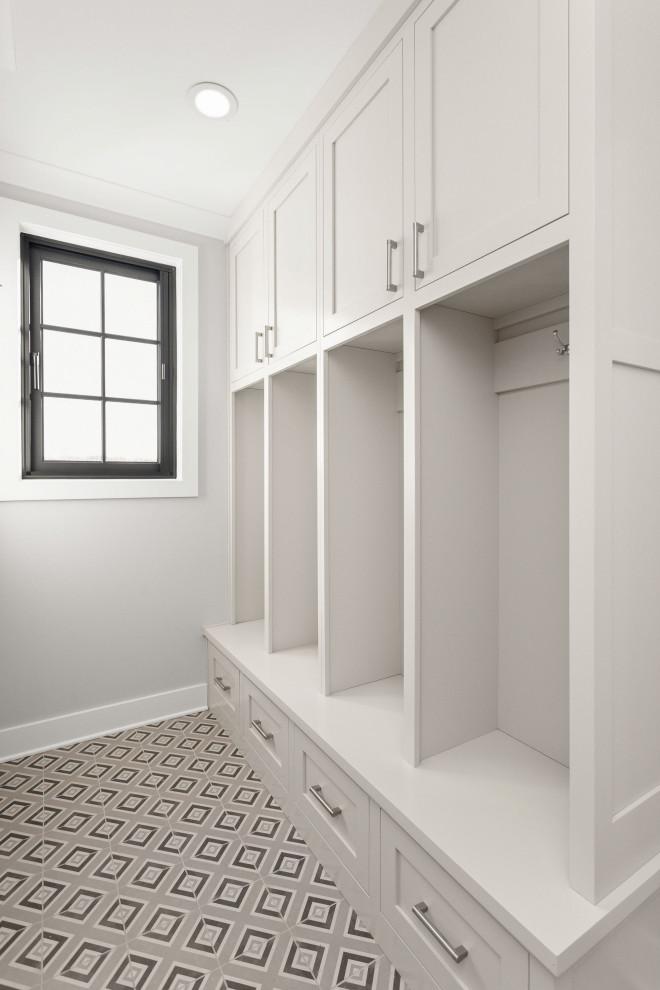 Inspiration for an expansive modern mudroom in Indianapolis with white walls, ceramic floors, a single front door, a white front door and multi-coloured floor.