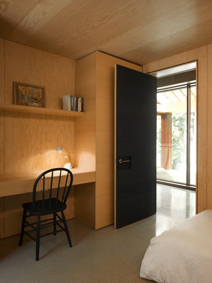 Idee per una camera degli ospiti design di medie dimensioni con pavimento in cemento, pavimento grigio, soffitto in legno e pareti in legno