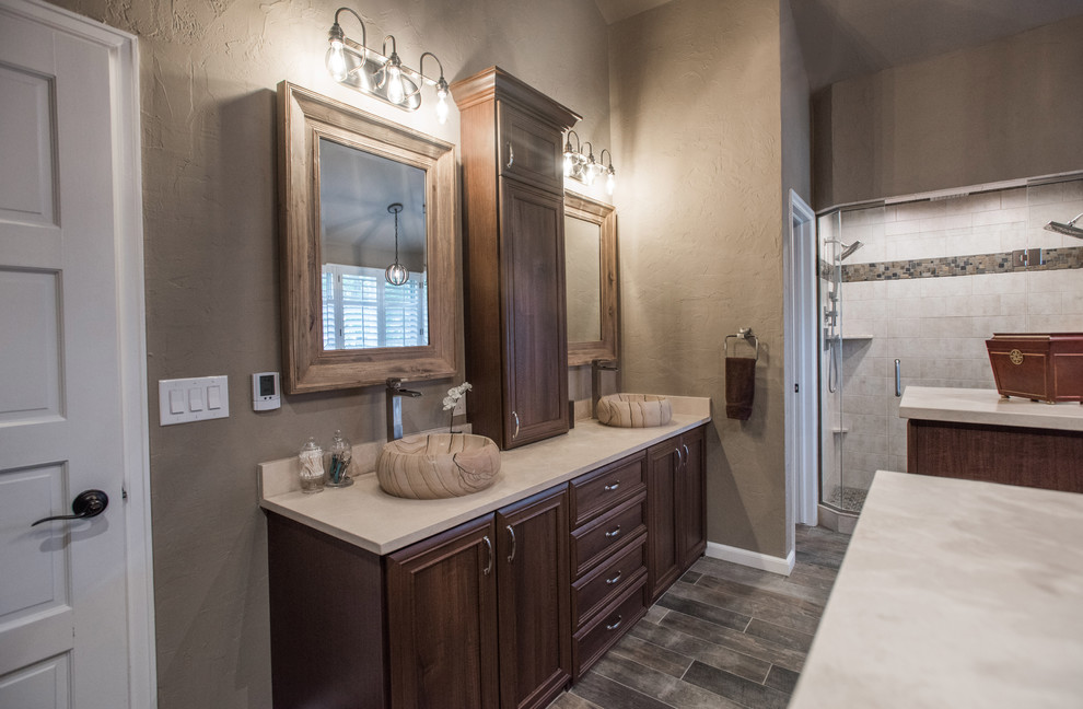 Photo of a large traditional bathroom in Denver with raised-panel cabinets, medium wood cabinets, plywood floors and brown floor.