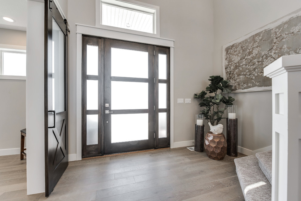 Photo of a mid-sized arts and crafts front door in Salt Lake City with beige walls, medium hardwood floors, a single front door and a medium wood front door.