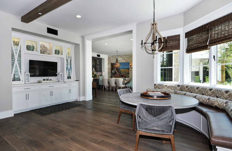 This is an example of a mid-sized country separate dining room in Orange County with grey walls, dark hardwood floors, no fireplace and brown floor.