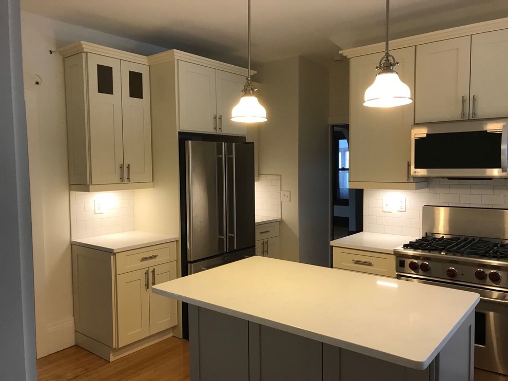 Eat-in kitchen - huge modern l-shaped eat-in kitchen idea with shaker cabinets and gray cabinets